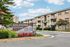 Charming Edlandria Apartments with manicured gardens and inviting balconies, located at 6166-6198 Edsall Road.