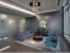 Lobby at AMLI 900 with grey modern decor and teal chairs