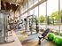Interior view of fitness center at AMLI at Mueller featuring a variety of weight machines and floor to ceiling windows