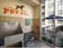 Interior of paw wash at AMLI at Mueller with dog washing and drying stations and a wall stencil reading Pet Spa on the wall