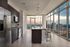 Gourmet kitchens with quartz countertops, modern light fixtures, and stainless-steel appliances