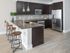 Gourmet kitchens with quartz countertops and backsplashes, modern light fixtures and stainless-steel appliances