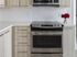 Stainless steel appliances and modern backsplashes