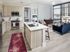 Floor to ceiling windows and ceiling fans in every room