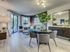 AMLI Joya, interior, dining living room, wood floor, sliding glass door to balcony