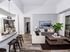 AMLI Joya, interior, open concept kitchen living room, stainless steel appliances, sliding glass door to balcony