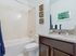 AMLI Toscana Place, interior, bathroom, shower/tub, dark cabinets, large mirror,