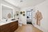 Warm wood vanity with unique bathroom layout