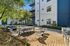 Lounge area and outdoor kitchen at AMLI Old 4th Ward with string lights