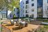 Courtyard lounge seating area at AMLI Old 4th Ward with table tennis and cornhole