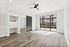 AMLI Old 4th Ward living room with gray wood flooring and office nook and bedroom sliding door and with glass patio doors