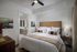 Bedroom with ceiling fan and bathroom