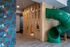 Wooden castle play area in East Building Free Play amenity