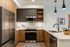 Modern kitchen with warm finish package and quartz countertops