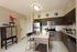 AMLI Dadeland kitchen with kitchen island and barstools