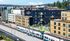Aerial view of AMLI Redmond Way apartments and a passing light rail train