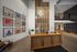 Inviting lobby space with modern wooden reception desk, stylish wall art, and contemporary lighting.