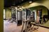 Modern fitness center equipped with state-of-the-art exercise machines and sleek design, offering a dynamic workout environment.