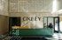 Inviting modern lobby with artistic lighting and stylish decor at Oxley Apartments, featuring a welcoming reception area.