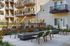 Chic apartment courtyard featuring modern outdoor seating and lush landscaping, perfect for relaxation and social gatherings.