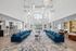 Elegant and spacious community lobby featuring modern seating, stylish pendant lighting, and welcoming open layout.