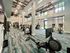 State-of-the-art fitness center with modern gym equipment, vibrant decor, and ample natural light.