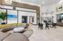 Modern apartment lobby with stylish curved seating, elegant lighting, and inviting communal areas.