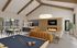 Chic and modern communal lounge with vaulted ceilings, featuring a cozy leather sofa, elegant dining area, billiard table, and a warm fireplace ambiance at Slate Springdale.