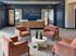 Inviting reception area at Slate Springdale with modern seating and elegant decor.