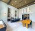 furnished clubroom with high ceilings
