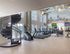 furnished fitness center and spiral staircase