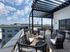 seating on rooftop deck overlooking city