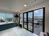 kitchen and rooftop deck overlooking city