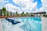 exterior pool with apartment building in daytime