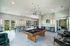 furnished clubroom with billiards table and seating