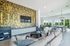 furnished clubroom with seating and television