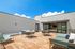 furnished outdoor rooftop deck with seating in daytime