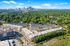aerial view of apartment buidling and trees in daytime
