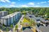 aerial view of apartment buidling and trees in daytime