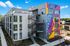 apartment building with mural in daytime