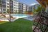 Pool and sundeck on sunny day