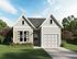 Pet-Friendly Houses for Rent in Opelika, AL - Champions Square - Exterior Two CGC Home with Tan Shutters, Glass Front Door, and Trees