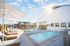 Pool with chairs and umbrellas on a sunny day