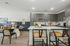 kitchen with large island and grey cabinets and dining room
