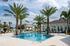 Pool and clubhouse on a sunny day