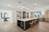 furnished clubroom with kitchen area and island