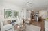 furnished living and kitchen area in apartment