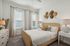 furnished bedroom with bed and window