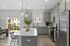 Furnished kitchen with large island and grey cabinets