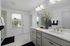 Large bathroom with double vanity and walk-in shower